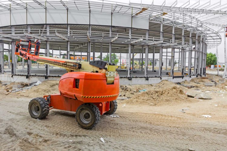 Cherry picker lift outside at an industrial construction site