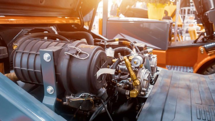 Exposed lift truck engine undergoing forklift repair