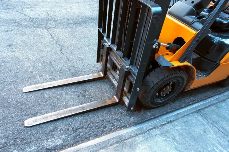 Forklift forks resting on the ground