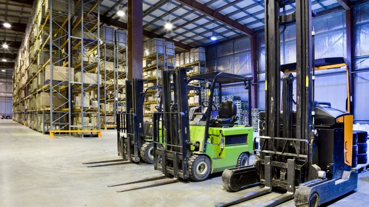 Warehouse forklift types with racking system in the background